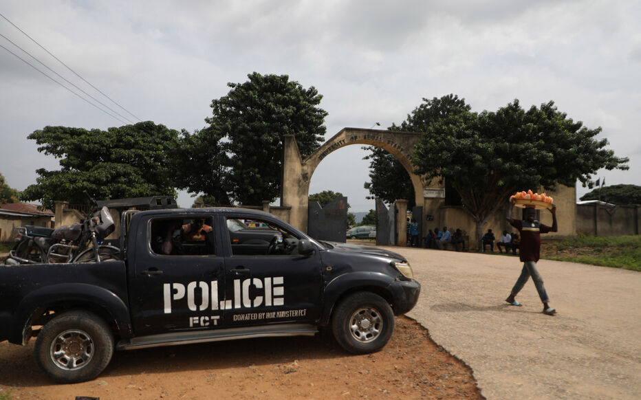 A police truck is stationed outside the University of Abuja Staff Quarters gate where unknown gunmen kidnapped people amongst whom were 2 of the university professors, lecturers and their family members in Abuja, Nigeria on November 2, 2021. - Gunmen abducted six people early on November 2, 2021 from a university near the international airport serving Nigerias capital Abuja, police said.
The dawn attack at the staff quarters of University of Abuja in Giri raised fears of safety around the Nnamdi Azikiwe International Airport, some 20 kilometres (12 miles) away. (Photo by Kola Sulaimon / AFP)