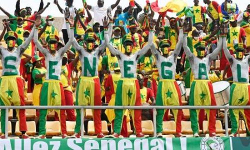 TOPSHOT - Senegal's supporters react during the Group B Africa Cup of Nations (CAN) 2021 football match between Senegal and Guinea at Stade de Kouekong in Bafoussam on January 14, 2022. (Photo by Pius Utomi EKPEI / AFP) (Photo by PIUS UTOMI EKPEI/AFP via Getty Images)